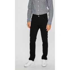 Jack & Jones - Spodnie. Czarne spodnie materiałowe męskie Jack & Jones, bez wzorów, z bawełny. W wyprzedaży za 89.90 zł.