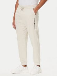 Tommy Hilfiger Spodnie dresowe UM0UM03664 Écru Regular Fit. Spodnie sportowe męskie Tommy Hilfiger, m, bez wzorów, z bawełny. Za 249.99 zł.