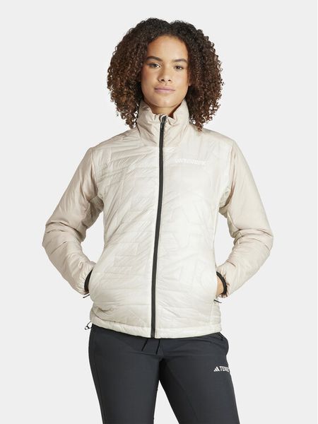 Adidas Kurtka outdoor IB4179 Beżowy Regular Fit. Brązowe kurtki sportowe damskie Adidas, s, bez wzorów, z syntetyku, bez ramiączek, bez kaptura, outdoorowe. Za 639.99 zł.