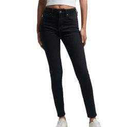 Damskie jeansy skinny z wysoką talią Superdry Vintage. Czarne jeansy damskie Superdry, z aplikacjami, z bawełny, klasyczne, z podwyższonym stanem. Za 380.75 zł.
