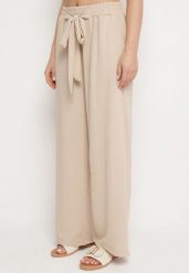 Beżowe Szerokie Spodnie z Wiskozą Wiązane w Pasie Zilenna. Brązowe spodnie materiałowe damskie Born2be, bez wzorów, z jeansu, eleganckie. Za 39.99 zł.