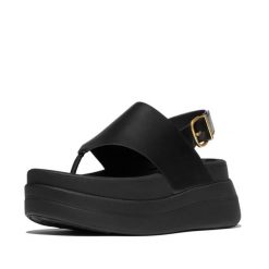 Kobiece sandały na koturnie ze skórzaną tylną paskiem FitFlop F-Mode. Czarne sandały damskie FIT FLOP, bez wzorów, z materiału, bez obcasa, na koturnie, bez zapięcia. Za 617.00 zł.