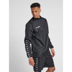 Kurtka przeciwdeszczowa Hummel Authentic Wind Breaker czarna. Białe kurtki męskie Hummel, m, bez wzorów, sportowe, bez kaptura. Za 139.00 zł.