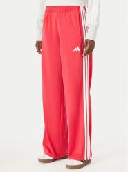 Adidas Spodnie dresowe Dayready KZ2513 Różowy Wide Leg. Czerwone spodnie dresowe damskie Adidas, bez wzorów, z dresówki. Za 199.99 zł.