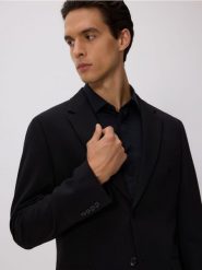 Marynarka slim fit - czarny. Czarne garnitury męskie Reserved, bez wzorów, z tkaniny. Za 329.99 zł.