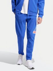 Adidas Spodnie dresowe Future Icons Badge of Sport IS9594 Niebieski Regular Fit. Niebieskie spodnie sportowe męskie Adidas, m, bez wzorów, z dresówki. Za 209.99 zł.