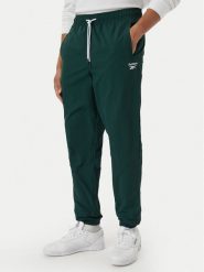Reebok Spodnie dresowe Mieszko RK25722CCM Zielony ciemny Regular Fit. Zielone spodnie sportowe męskie Reebok, m, bez wzorów, z dresówki. Za 299.99 zł.