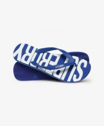 Superdry Klapki Core Logo z gumy, lekkie i wygodne – Regal Blue/Optic. Niebieskie klapki damskie Superdry, bez wzorów, z gumy, bez zapięcia. Za 134.40 zł.
