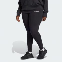 Legginsy Essentials Linear Cotton (Plus Size). Białe legginsy damskie Adidas, bez wzorów, z bawełny. W wyprzedaży za 69.50 zł.