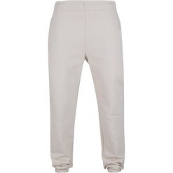 Spodnie dresowe Urban Classics. Białe spodnie sportowe męskie Urban Classics, m, bez wzorów, z bawełny, do biegania. Za 267.50 zł.