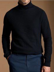 Sweter z golfem - czarny. Czarne swetry męskie Sinsay, l, bez wzorów, bez kołnierzyka, bez ramiączek. Za 59.99 zł.
