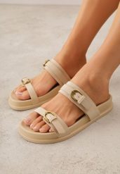 Beżowe Klapki z Dwoma Paskami i Klamrami Cevinra. Brązowe klapki damskie Born2be, na lato, bez wzorów, eleganckie, bez obcasa, na płaskiej podeszwie, bez zapięcia. Za 79.99 zł.