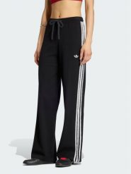 Adidas Spodnie dresowe Firebird KS9363 Czarny Regular Fit. Czarne spodnie dresowe damskie Adidas, bez wzorów, z dresówki. Za 348.99 zł.