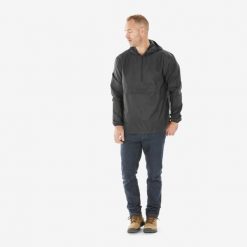 Kurtka turystyczna męska Quechua Raincut suwak pod szyją wodoodporna. Czarne kurtki męskie QUECHUA, m, bez wzorów, z materiału, sportowe, bez kaptura. Za 54.99 zł.
