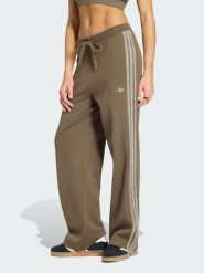 Adidas Spodnie dresowe Firebird KS7362 Brązowy Regular Fit. Brązowe spodnie dresowe damskie Adidas, bez wzorów, z dresówki. Za 348.99 zł.