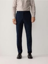Spodnie garniturowe slim fit - granatowy. Niebieskie garnitury męskie Reserved, bez wzorów, z tkaniny. W wyprzedaży za 129.99 zł.