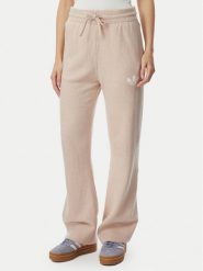 Adidas Spodnie dresowe Essentials KR9180 Beżowy Loose Fit. Brązowe spodnie dresowe damskie Adidas, bez wzorów, z dresówki. Za 299.99 zł.