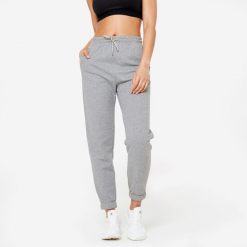 Spodnie dresowe damskie Domyos Gym & Pilates. Szare spodnie dresowe damskie DOMYOS, bez wzorów, z bawełny, sportowe. Za 89.99 zł.