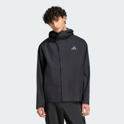 KURTKA PRZECIWDESZCZOWA ESSENTIALS. Czarne kurtki męskie Adidas, l, bez wzorów, z materiału, bez kaptura. Za 439.00 zł.