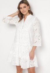 Biała Rozkloszowana Sukienka Boho z Haftowanej Tkaniny z Bawełny Loraviel. Białe sukienki damskie Born2be, na co dzień, m, bez wzorów, z bawełny, boho, bez kołnierzyka, bez ramiączek, mini, kopertowe. Za 119.99 zł.