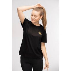 T-shirt do jogi Moonholi Awaken z krótkim rękawem. Czarne t-shirty damskie MOONHOLI, s, bez wzorów, sportowe, bez kołnierzyka, bez ramiączek. Za 99.00 zł.