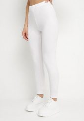Białe Bawełniane Legginsy z Gumką w Pasie i Niskim Stanem Lexuna. Białe legginsy damskie Born2be, bez wzorów, z bawełny. Za 19.99 zł.