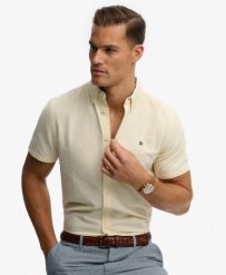 Superdry Koszula Preppy Oxford krótki rękaw Pastel Yellow Chambray. Żółte koszule damskie Superdry, uniwersalny, bez wzorów, z bawełny, klasyczne, bez kołnierzyka, bez ramiączek. Za 301.95 zł.