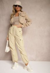 Beżowe Spodnie Cargo High Waist z Ozdobnymi Kieszeniami Leriora. Brązowe spodnie materiałowe damskie Renee, bez wzorów, z jeansu, eleganckie, z podwyższonym stanem. Za 39.99 zł.