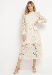 Beżowa Koronkowa Sukienka z Paskiem w Talii i Falbanką Nicasta. Brązowe sukienki damskie Born2be, na co dzień, l, bez wzorów, z koronki, eleganckie, bez kołnierzyka, bez ramiączek, maxi, proste. Za 249.99 zł.