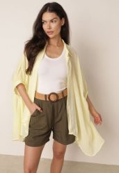 Żółta Zwiewna Koszula Letnia Oversize z Bawełny o Nietoperzowym Kroju Canomela. Żółte koszule damskie Born2be, l, bez wzorów, z bawełny, eleganckie, bez kołnierzyka, bez ramiączek. Za 139.99 zł.