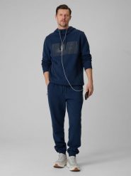 4F Spodnie dresowe joggery męskie - granatowe XXL. Niebieskie spodnie materiałowe męskie 4F, bez wzorów, z bawełny. Za 179.99 zł.