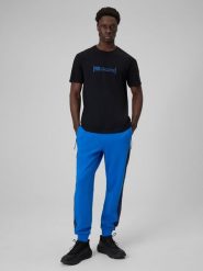 4F Spodnie dresowe joggery męskie - niebieskie L. Niebieskie spodnie sportowe męskie 4F, l, bez wzorów, z dresówki, na fitness i siłownię. Za 159.99 zł.