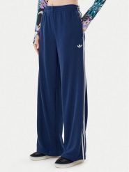 Adidas Spodnie dresowe adicolor Firebird JV7524 Granatowy Regular Fit. Niebieskie spodnie dresowe damskie Adidas, bez wzorów, z dresówki. Za 279.99 zł.