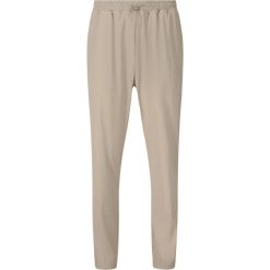 Damskie spodnie dresowe Athlecia Amisa. Brązowe spodnie dresowe damskie Athlecia, bez wzorów, z dresówki, sportowe. Za 243.50 zł.