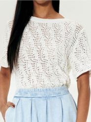 Sweter z wiązaniem - kremowy. Białe swetry nierozpinane damskie Sinsay, l, bez wzorów, bez kołnierzyka, bez ramiączek. Za 39.99 zł.