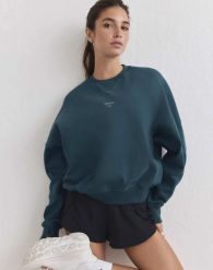 Damska bluza biegowa oddychająca, odprowadzająca wilgoć Le Run lagunowa. Zielone bluzy damskie Aim'n, l, bez wzorów, z bawełny, bez ramiączek, bez kaptura. Za 387.00 zł.