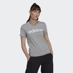 T-shirt damski z logo adidas Essentials. Białe t-shirty damskie Adidas, l, bez wzorów, z bawełny, klasyczne, bez kołnierzyka, bez ramiączek. Za 64.79 zł.