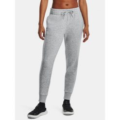 Spodnie Damskie Dresowe Joggery Under Armour Rival Fleece. Szare spodnie dresowe damskie Under Armour, bez wzorów, z dresówki, sportowe, na fitness i siłownię. W wyprzedaży za 149.88 zł.