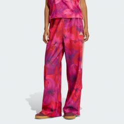 SPODNIE DRESOWE ADIDAS x FARM RIO HOUSE OF TIRO. Białe spodnie dresowe damskie Adidas, bez wzorów, z dresówki, sportowe, na fitness i siłownię. Za 279.00 zł.