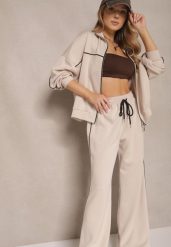 Jasnobeżowy Retro Komplet Dresowy z Wiskozą Bluza i Spodnie o Szerokim Kroju Selriza. Brązowe bluzy damskie Renee, z aplikacjami, z dresówki, eleganckie, bez ramiączek, bez kaptura. Za 159.99 zł.