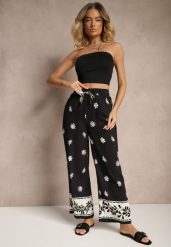 Czarne Wiskozowe Spodnie o Szerokim Kroju z Gumką w Pasie w Kwiatowy Wzór Nimilassa. Czarne spodnie materiałowe damskie Renee, bez wzorów, z jeansu, eleganckie. Za 84.99 zł.