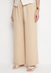 Beżowe Spodnie Palazzo o Szerokim Kroju z Wysokim Stanem Aravenna. Brązowe spodnie materiałowe damskie Born2be, z aplikacjami, z jeansu, eleganckie, z podwyższonym stanem. Za 34.99 zł.