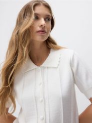 Kardigan z kołnierzem - kremowy. Białe kardigany damskie Reserved, l, bez wzorów, z dzianiny, bez kołnierzyka. Za 129.99 zł.