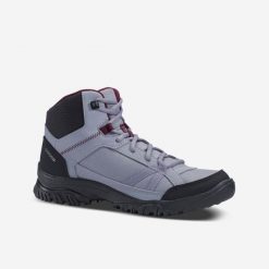 Buty turystyczne damskie Quechua NH100 mid. Brązowe obuwie trekkingowe damskie QUECHUA, z syntetyku, przed kolano, bez zapięcia. W wyprzedaży za 59.99 zł.