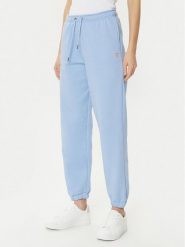 Guess Jeans Spodnie dresowe W4YB33 KC811 Niebieski Regular Fit. Niebieskie spodnie dresowe damskie Guess Jeans, z aplikacjami, z dresówki. Za 189.99 zł.