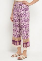 Fioletowe Bawełniane Spodnie z Wysokim Stanem o Długości 7/8 ze Wzorem Boho Lisavinea. Fioletowe spodnie materiałowe damskie Born2be, z aplikacjami, z bawełny, boho, z podwyższonym stanem. Za 29.99 zł.