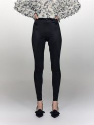 Połyskujące legginsy - czarny. Czarne legginsy damskie Reserved, bez wzorów, z dzianiny. W wyprzedaży za 55.99 zł.
