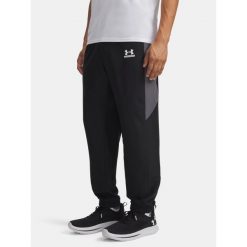 Spodnie męskie Under Armour Tech Sport /castlerock/. Czarne spodnie sportowe męskie Under Armour, m, bez wzorów, na fitness i siłownię. Za 299.99 zł.