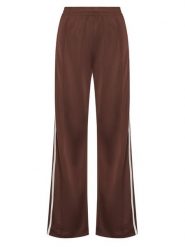 Adidas Spodnie dresowe adicolor Firebird KD2526 Brązowy Loose Fit. Brązowe spodnie dresowe damskie Adidas, bez wzorów, z dresówki. Za 259.99 zł.