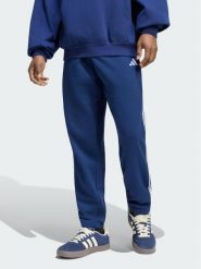 Adidas Spodnie dresowe Essentials 3-Stripes French Terry KY4197 Niebieski Regular Fit. Niebieskie spodnie sportowe męskie Adidas, m, bez wzorów, z bawełny. Za 208.99 zł.